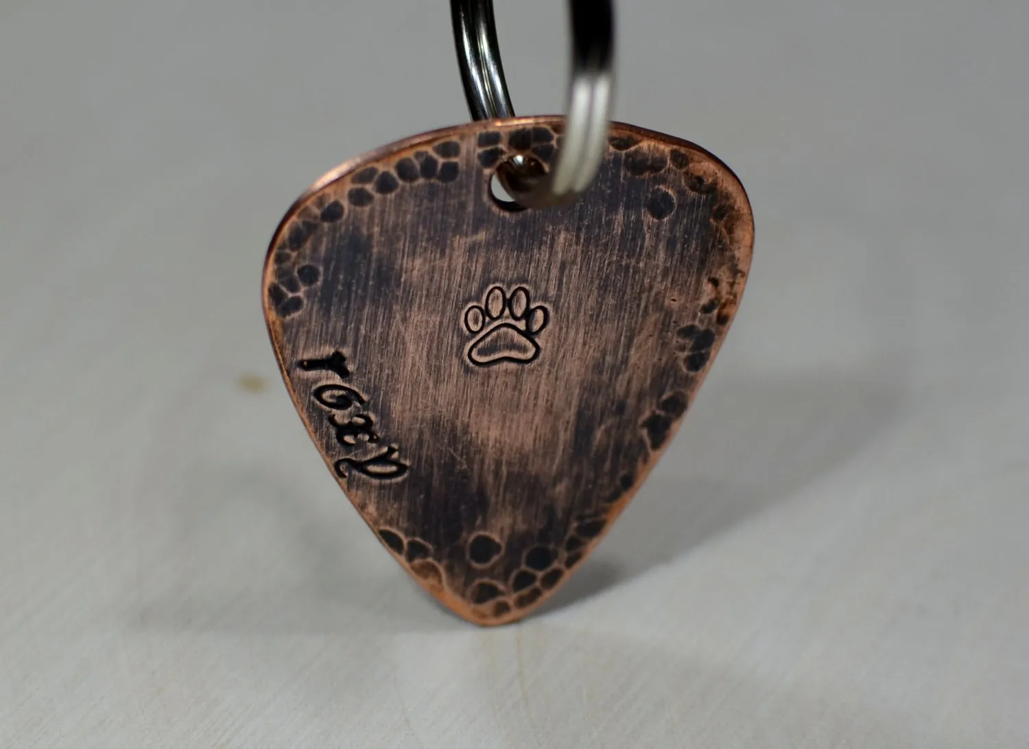 Guitar pick dog tag with rustic hammered finish