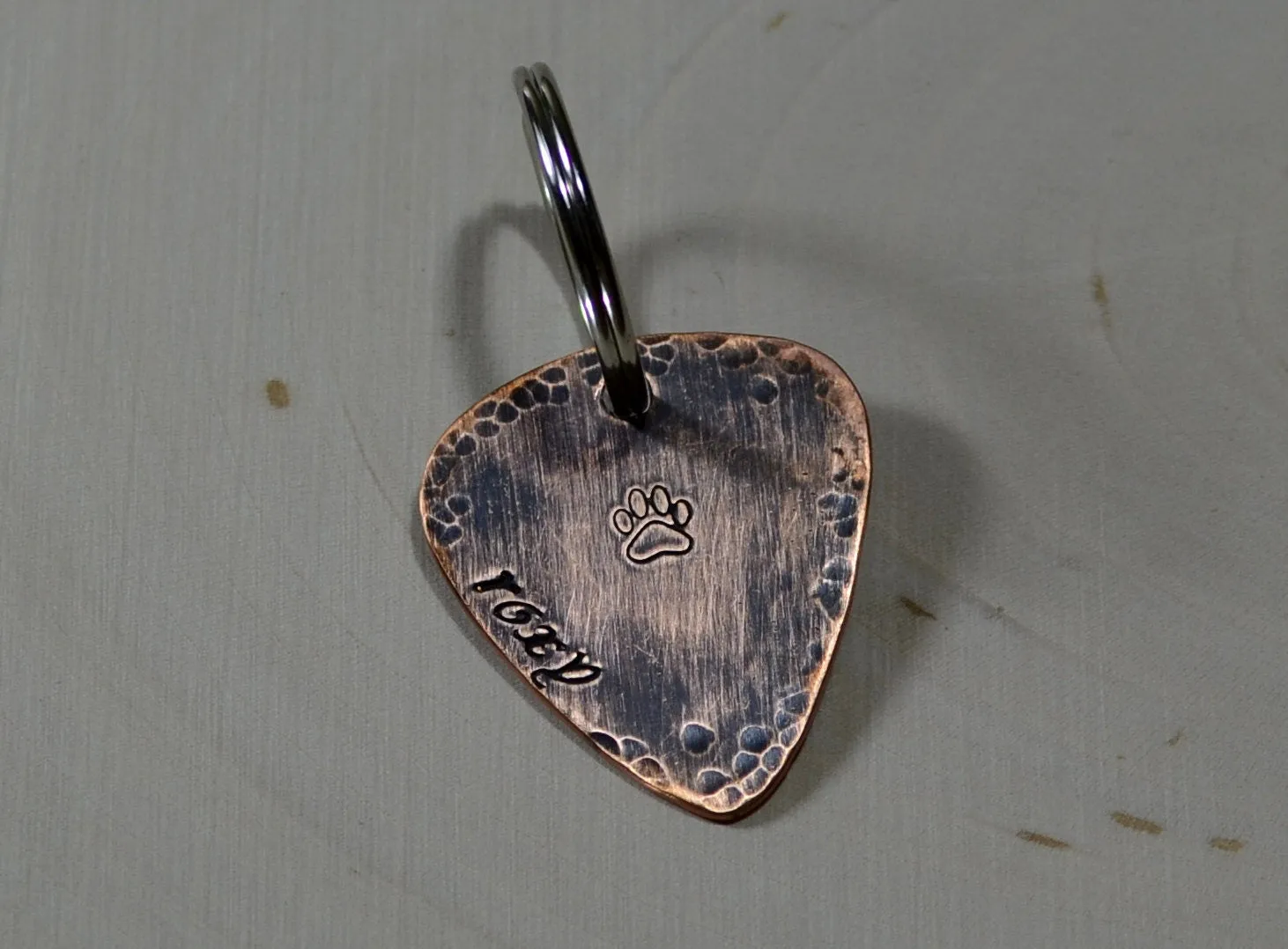 Guitar pick dog tag with rustic hammered finish